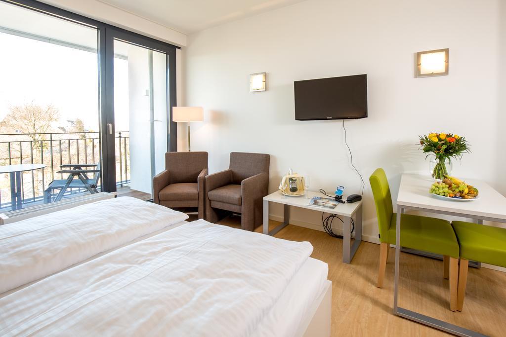 Carat Apartments Grömitz Quarto foto